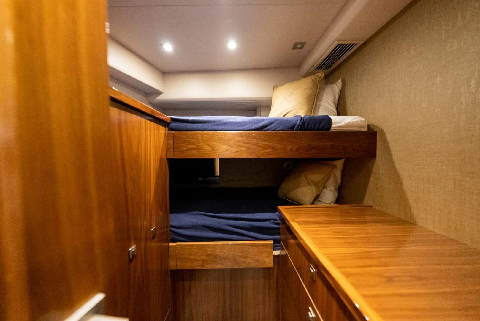 a bed with a desk aboard SIR' REEL Yacht for Sale