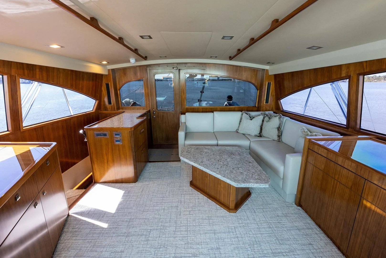 a large living room with a large window aboard SIR' REEL Yacht for Sale