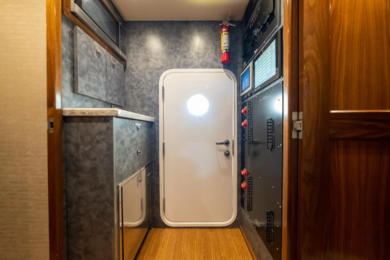 a room with a door and a machine in it aboard SIR' REEL Yacht for Sale