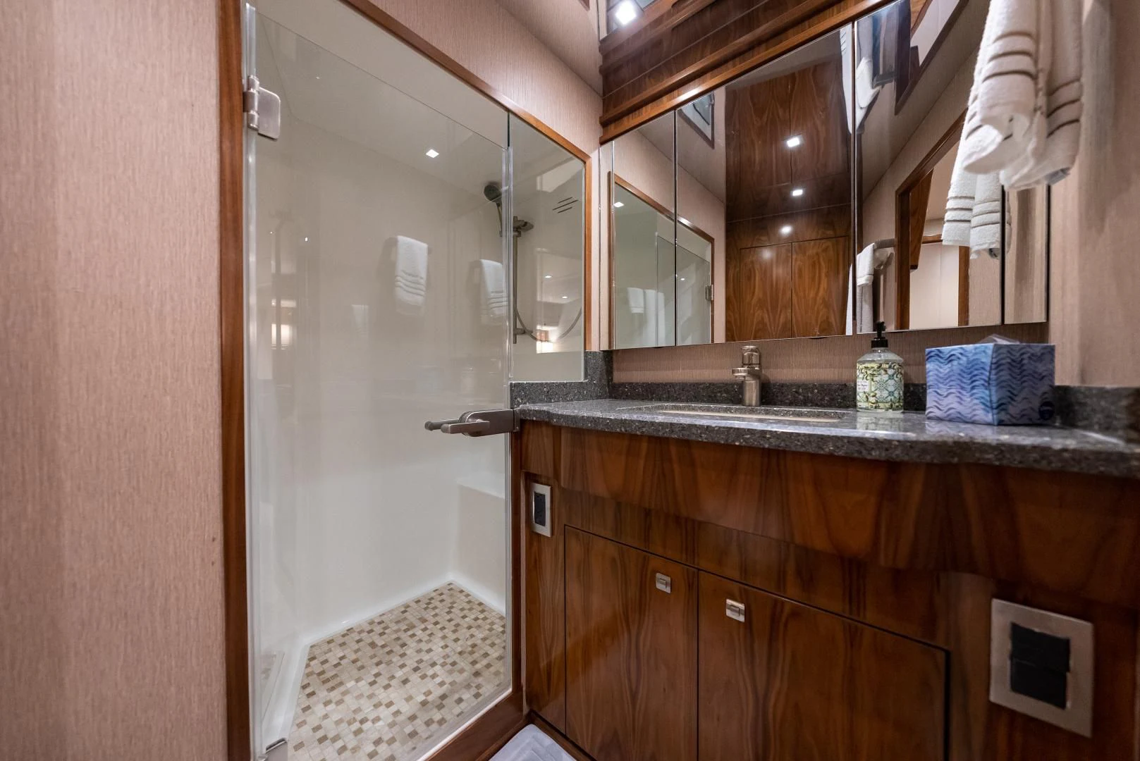 a bathroom with a glass shower aboard SIR' REEL Yacht for Sale