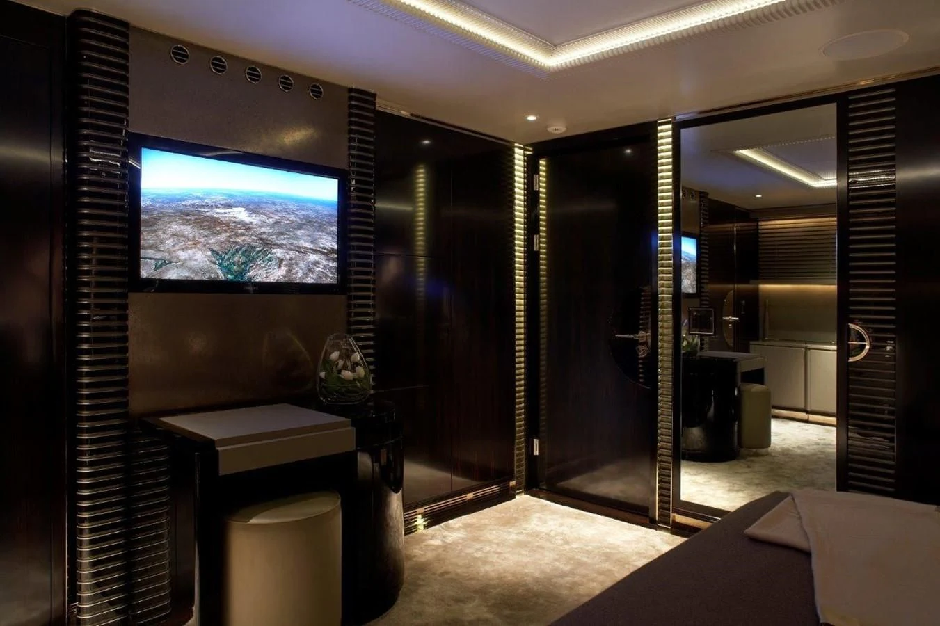 a room with a tv and a table aboard SEALION Yacht for Sale