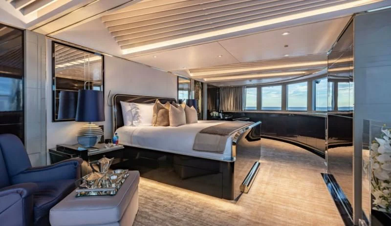 a large bedroom with a large bed aboard SEALION Yacht for Sale