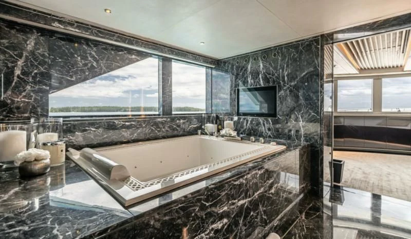 a large bathroom with a large tub aboard SEALION Yacht for Sale