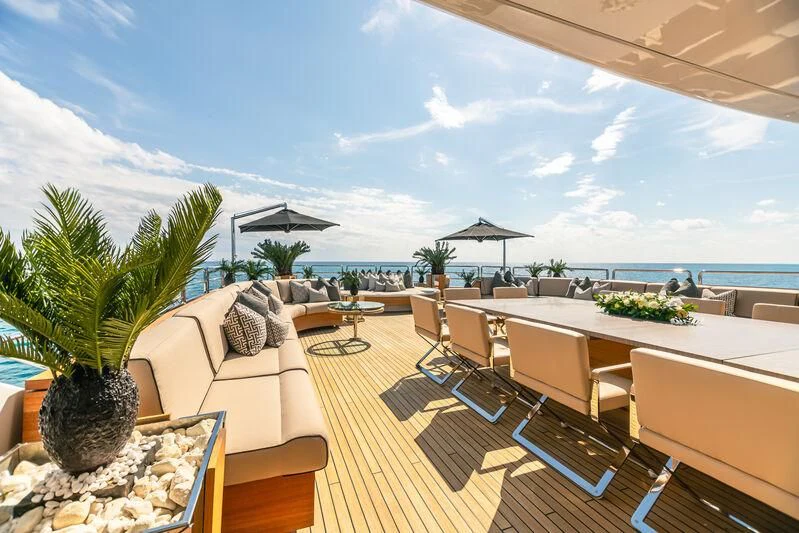a patio with chairs and tables aboard SEALION Yacht for Sale