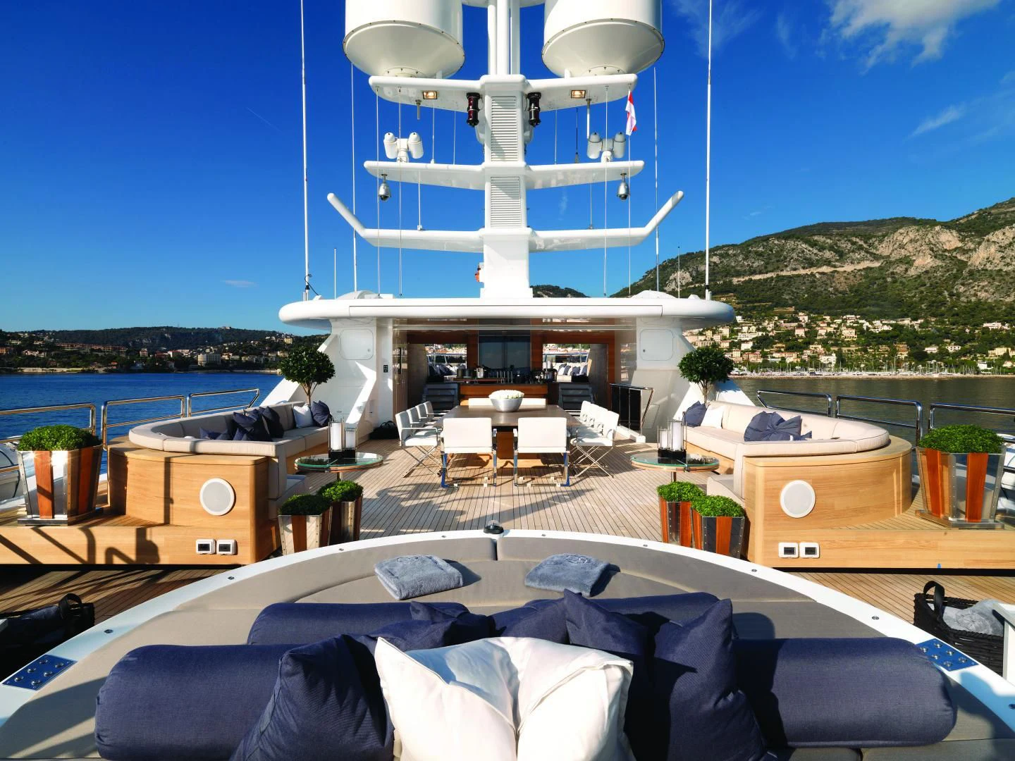 a large white building with a balcony overlooking a body of water aboard SEALION Yacht for Sale