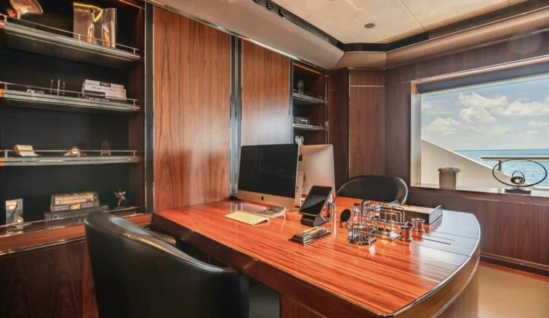 a room with a desk and computer aboard SEALION Yacht for Sale