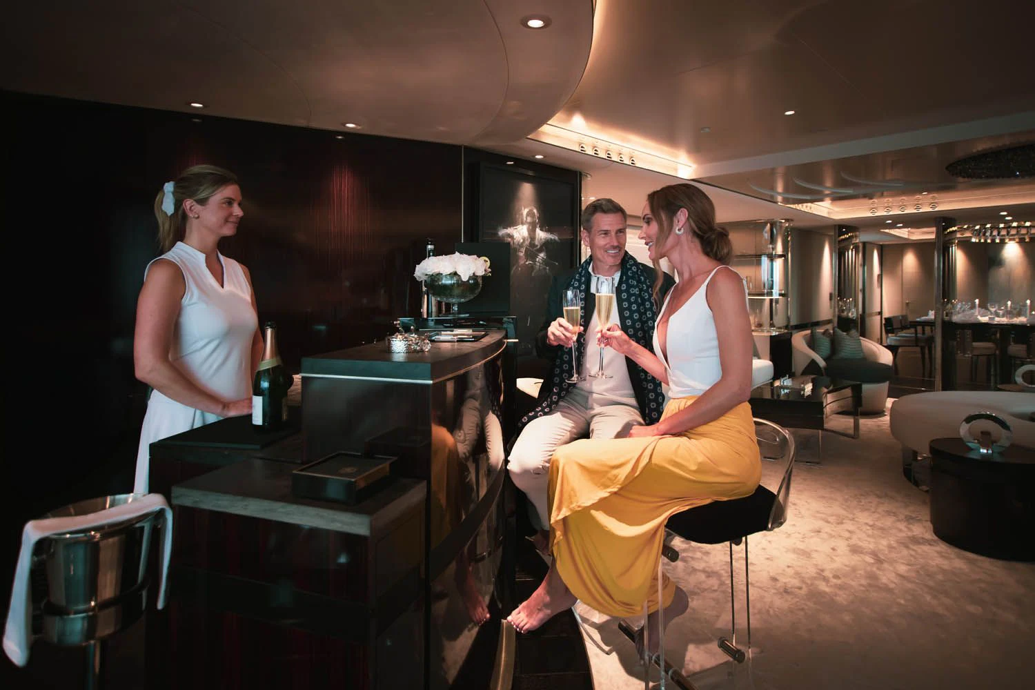 a group of people sitting in a bar aboard SEALION Yacht for Sale