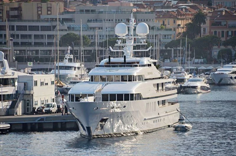 a large white boat sits in the water aboard SEALION Yacht for Sale