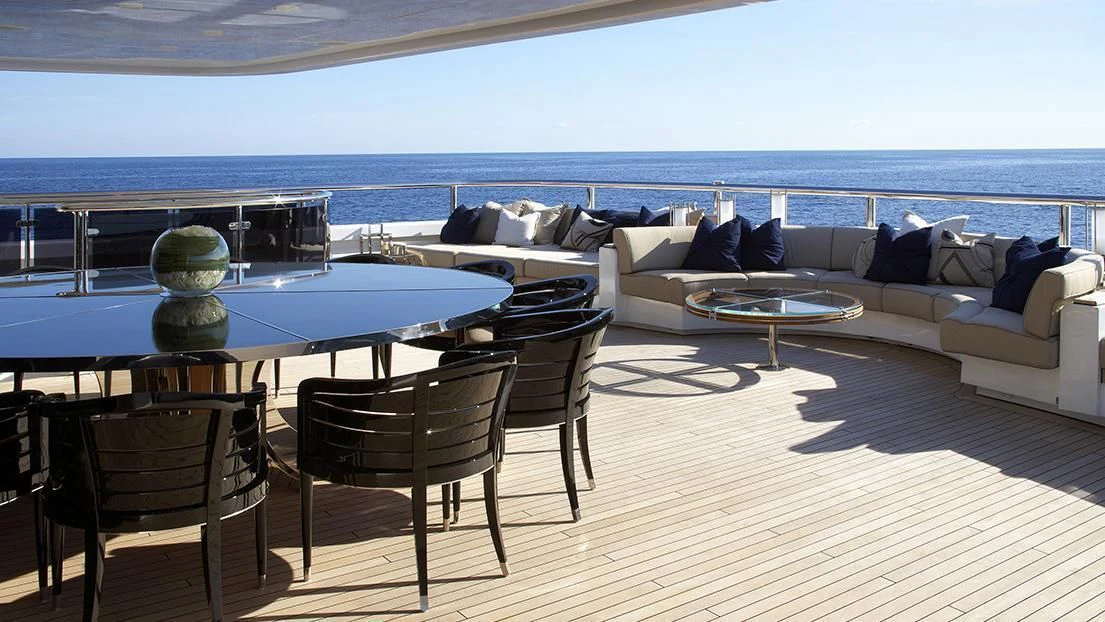 a living room with a couch and a table aboard SEALION Yacht for Sale