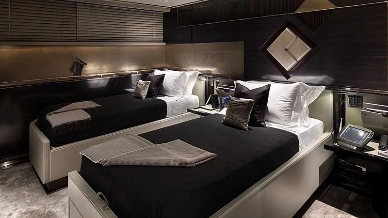 a room with a bed and a couch aboard SEALION Yacht for Sale