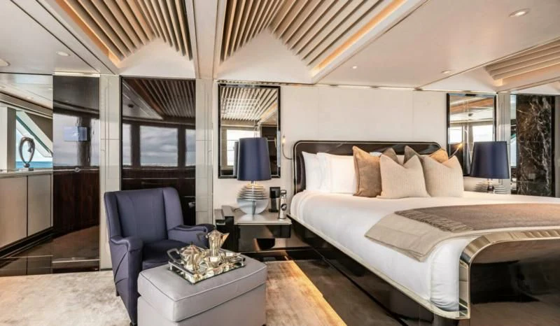 a large bed in a room aboard SEALION Yacht for Sale