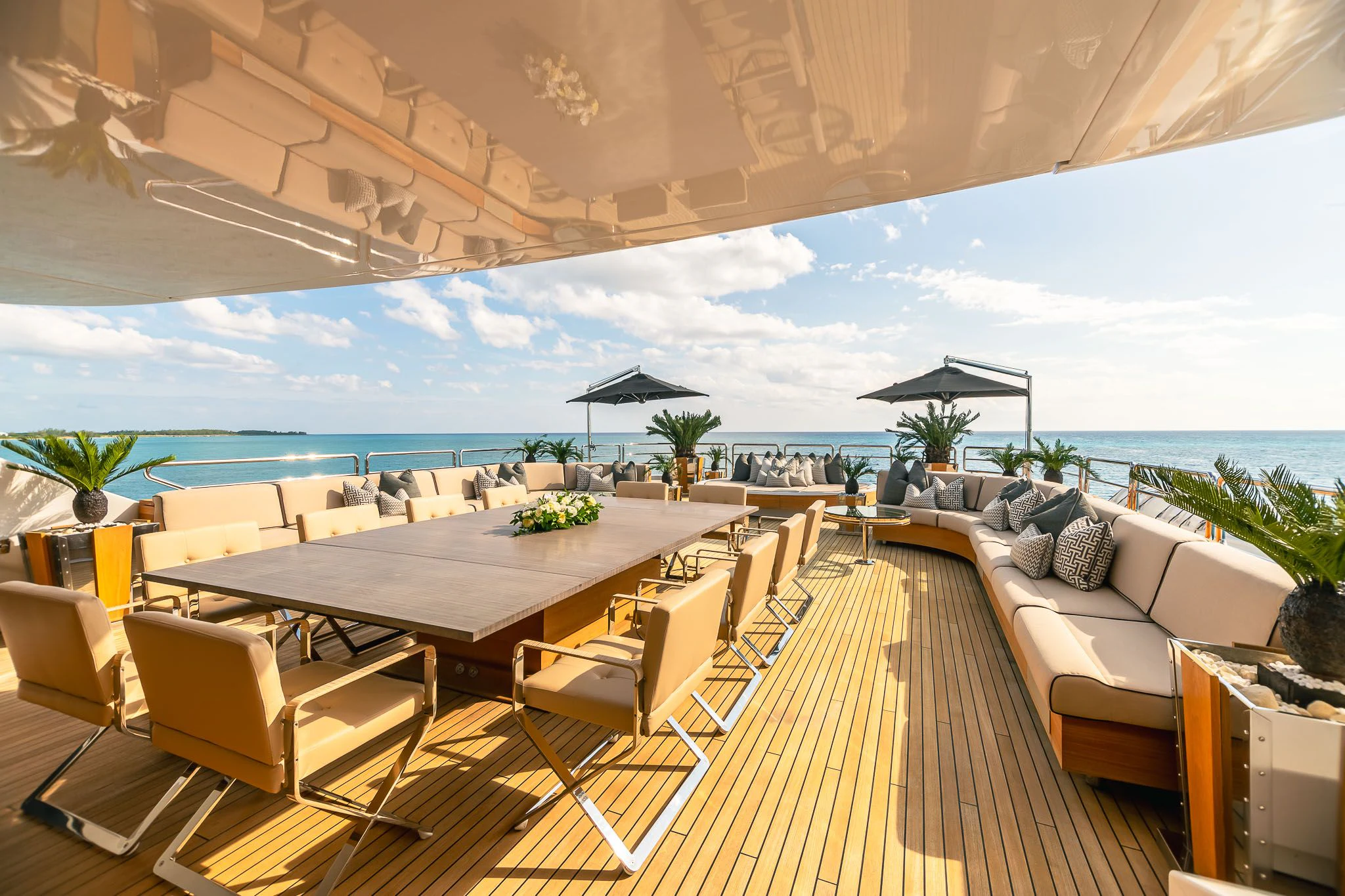 a room with a table and chairs aboard SEALION Yacht for Sale