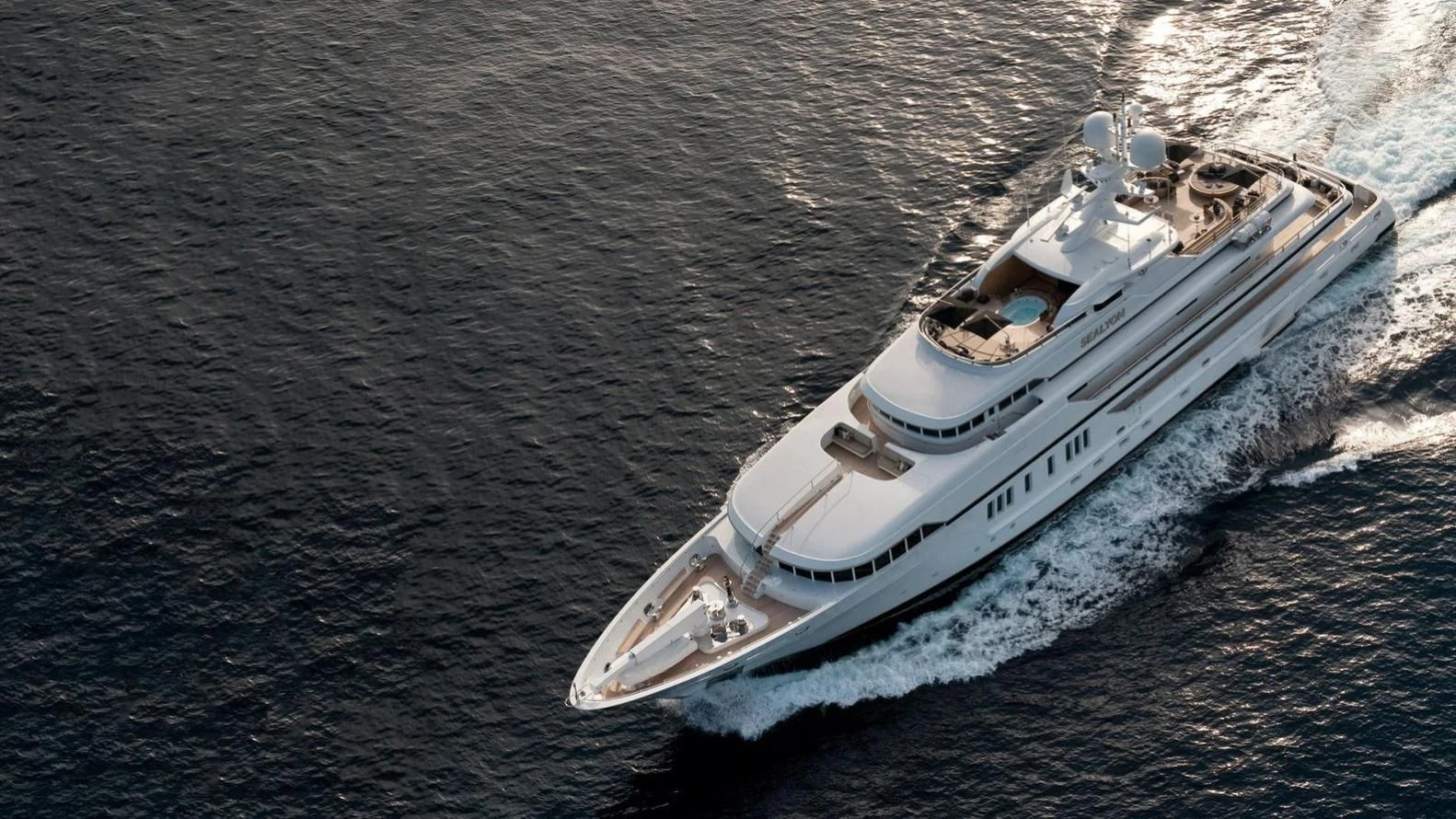 a white boat on the water aboard SEALION Yacht for Sale