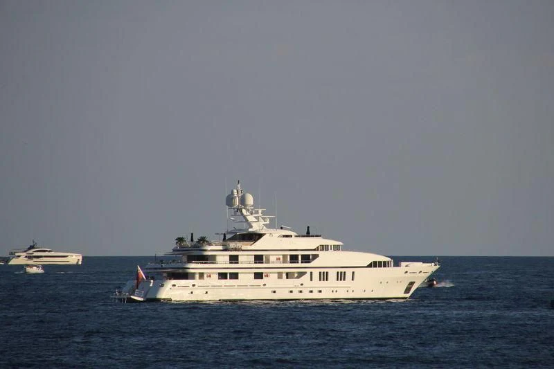 a large white boat in the water aboard SEALION Yacht for Sale