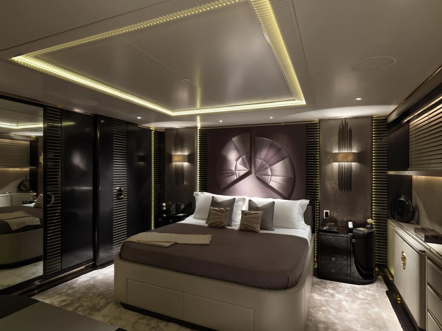 a large bedroom with a large mirror aboard SEALION Yacht for Sale