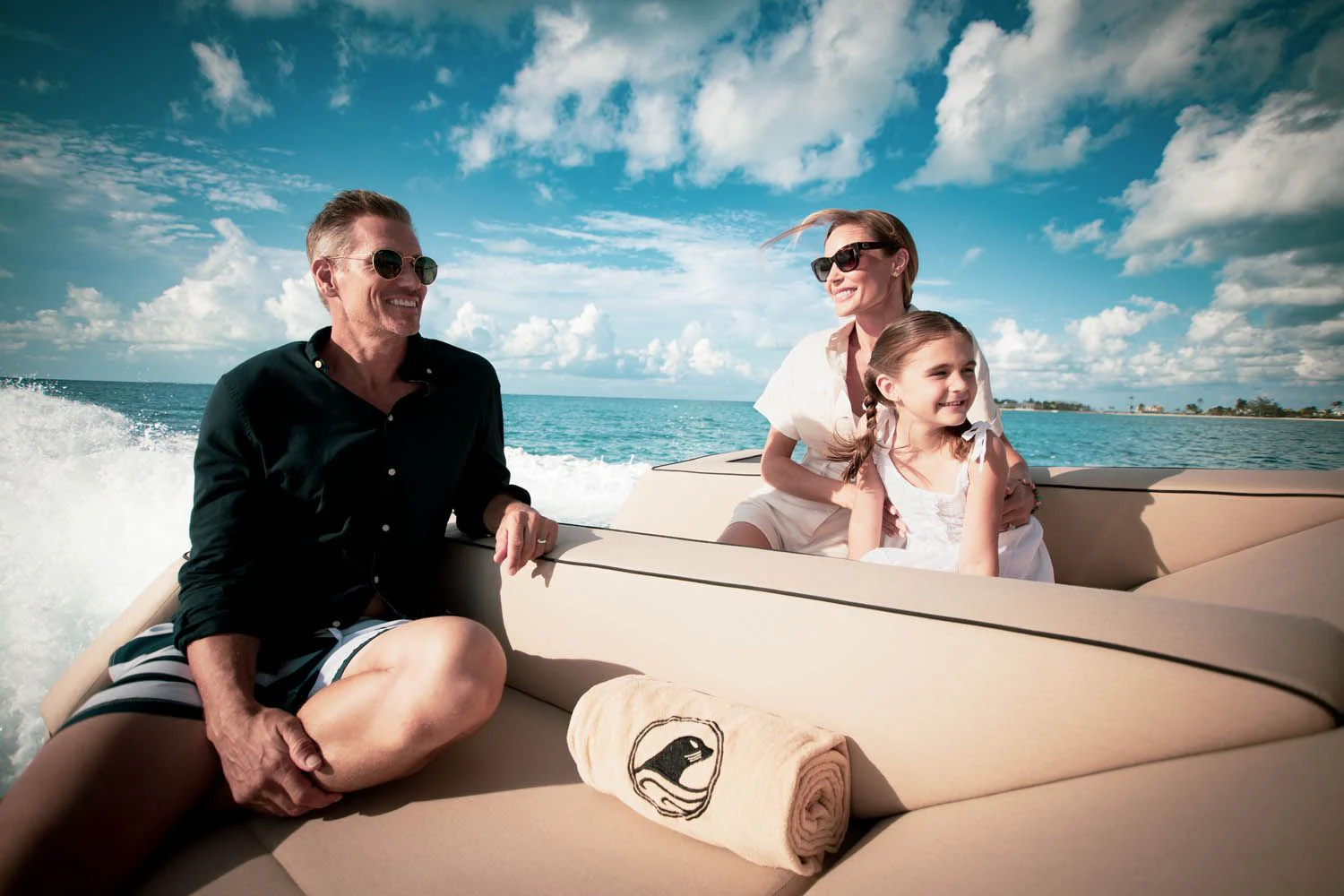 a man and a woman sitting on a boat on the beach aboard SEALION Yacht for Sale