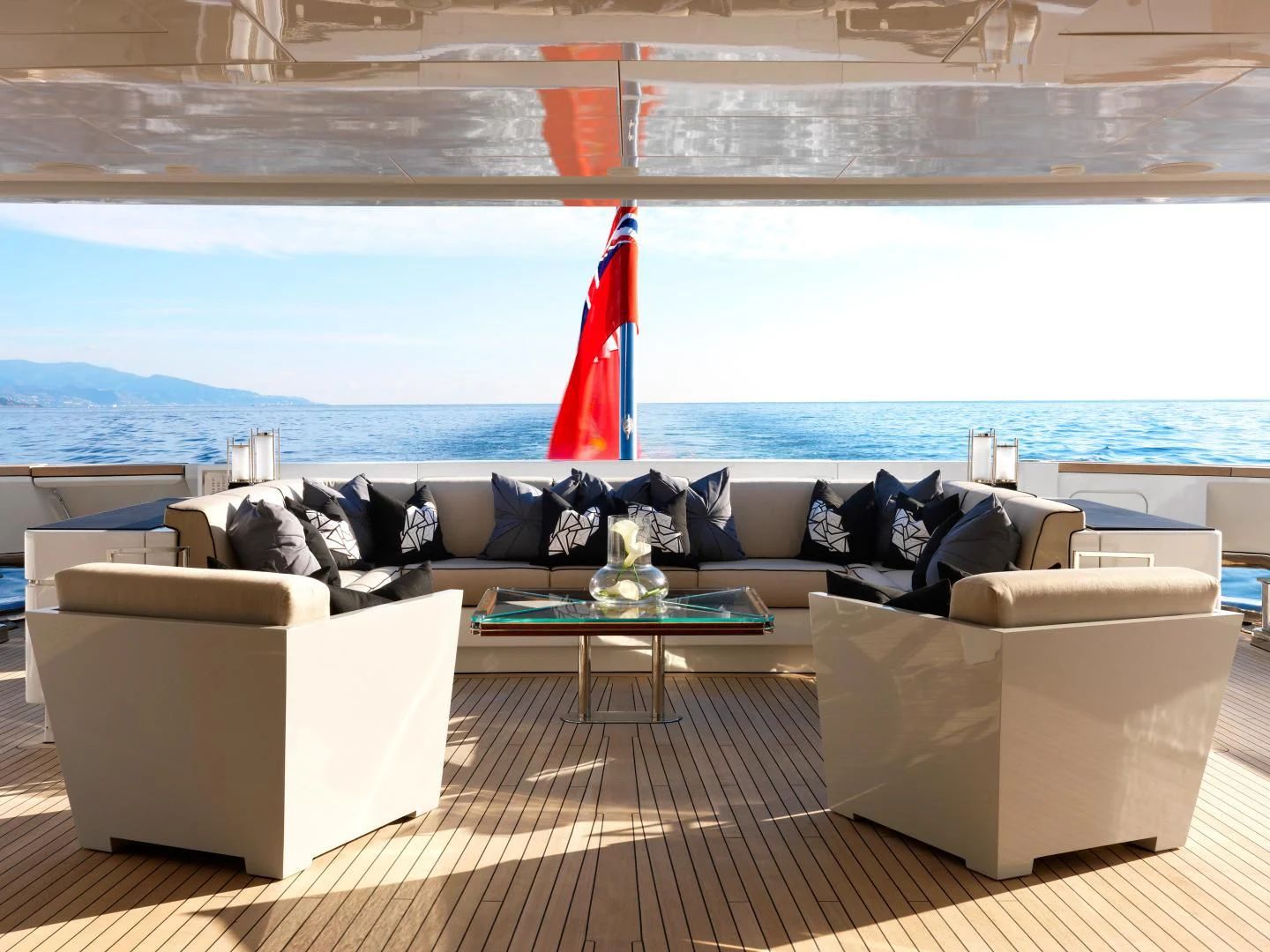a living room with a large window overlooking the ocean aboard SEALION Yacht for Sale