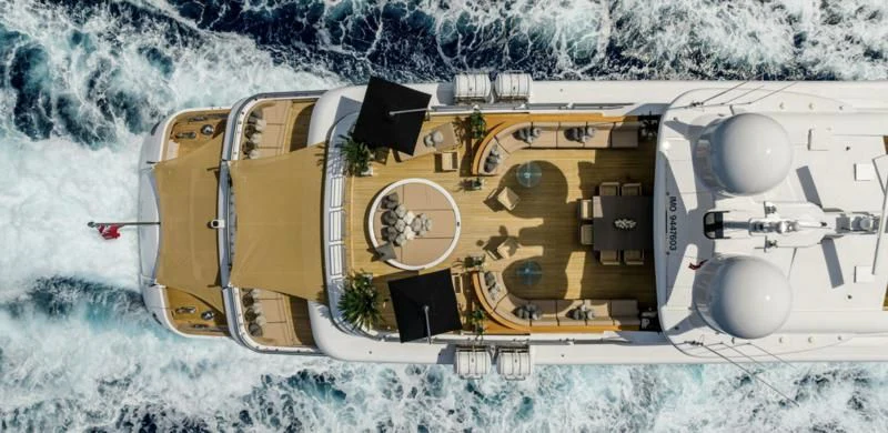a large yellow vehicle on a snowy road aboard SEALION Yacht for Sale