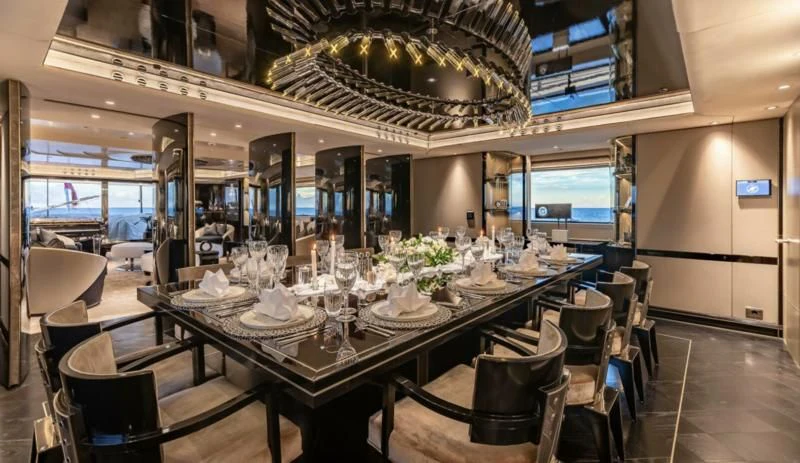 a dining room with tables and chairs aboard SEALION Yacht for Sale