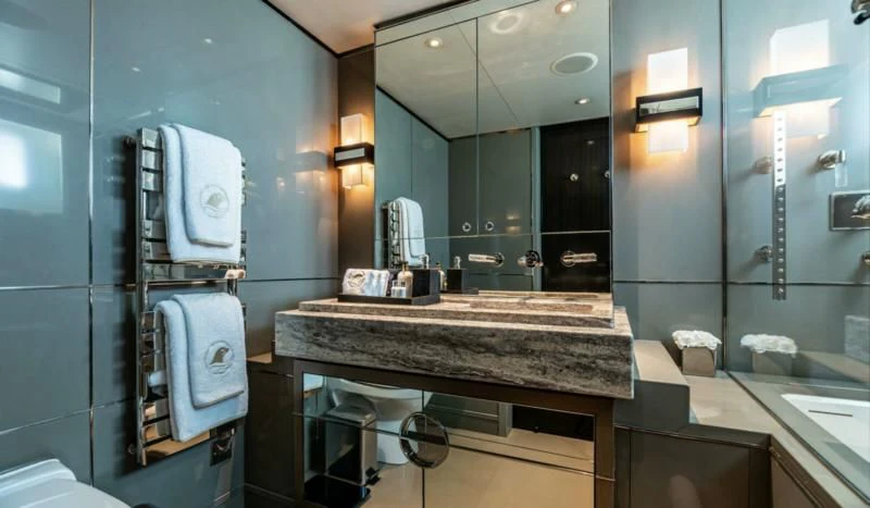 a bathroom with a large mirror aboard SEALION Yacht for Sale