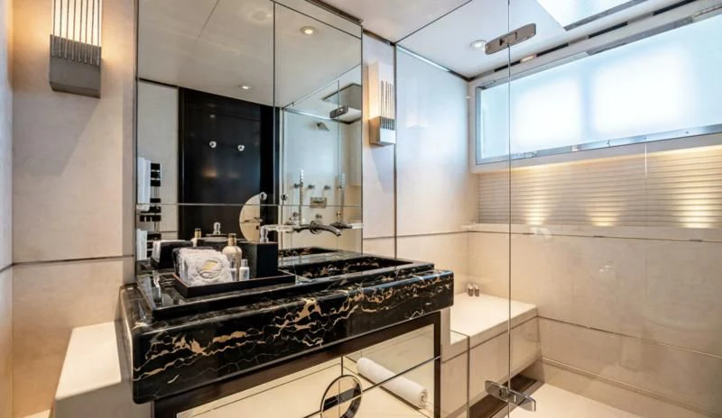 a bathroom with a glass shower aboard SEALION Yacht for Sale