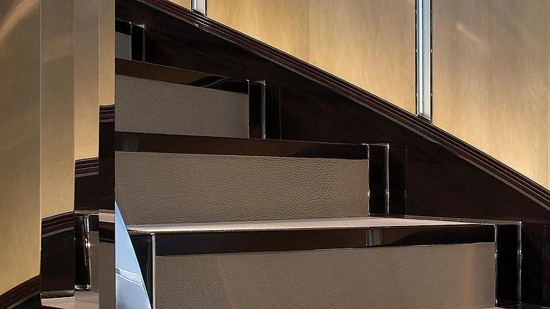 a black and white staircase aboard SEALION Yacht for Sale