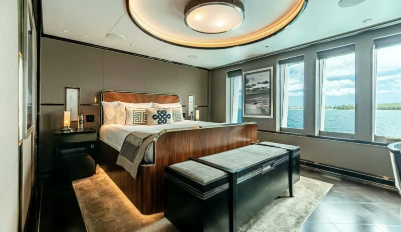 a bedroom with a bed aboard SEALION Yacht for Sale