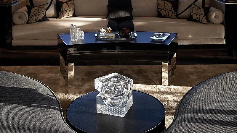 a coffee table with a glass on top aboard SEALION Yacht for Sale