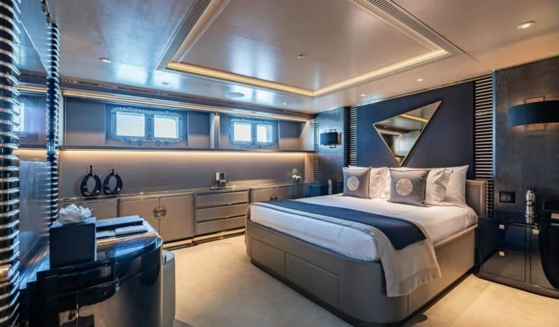 a room with a bed and a desk aboard SEALION Yacht for Sale