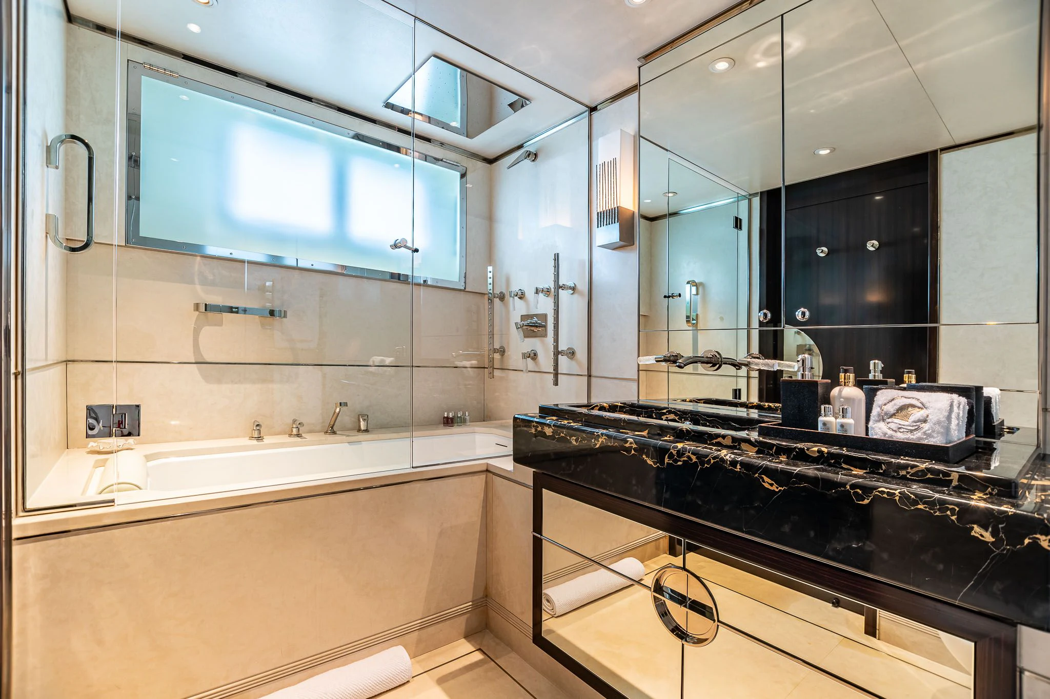 a bathroom with a large mirror aboard SEALION Yacht for Sale