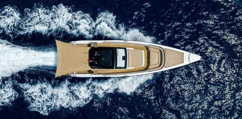 a yellow and white boat in the water aboard SEALION Yacht for Sale