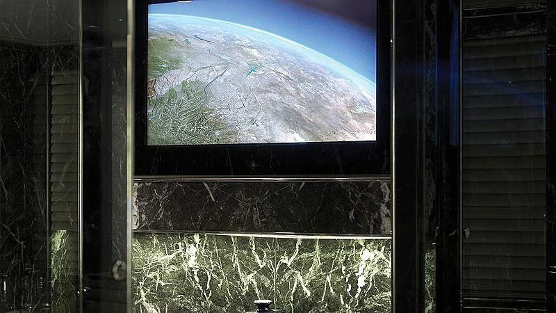 a view of a mountain from a window aboard SEALION Yacht for Sale