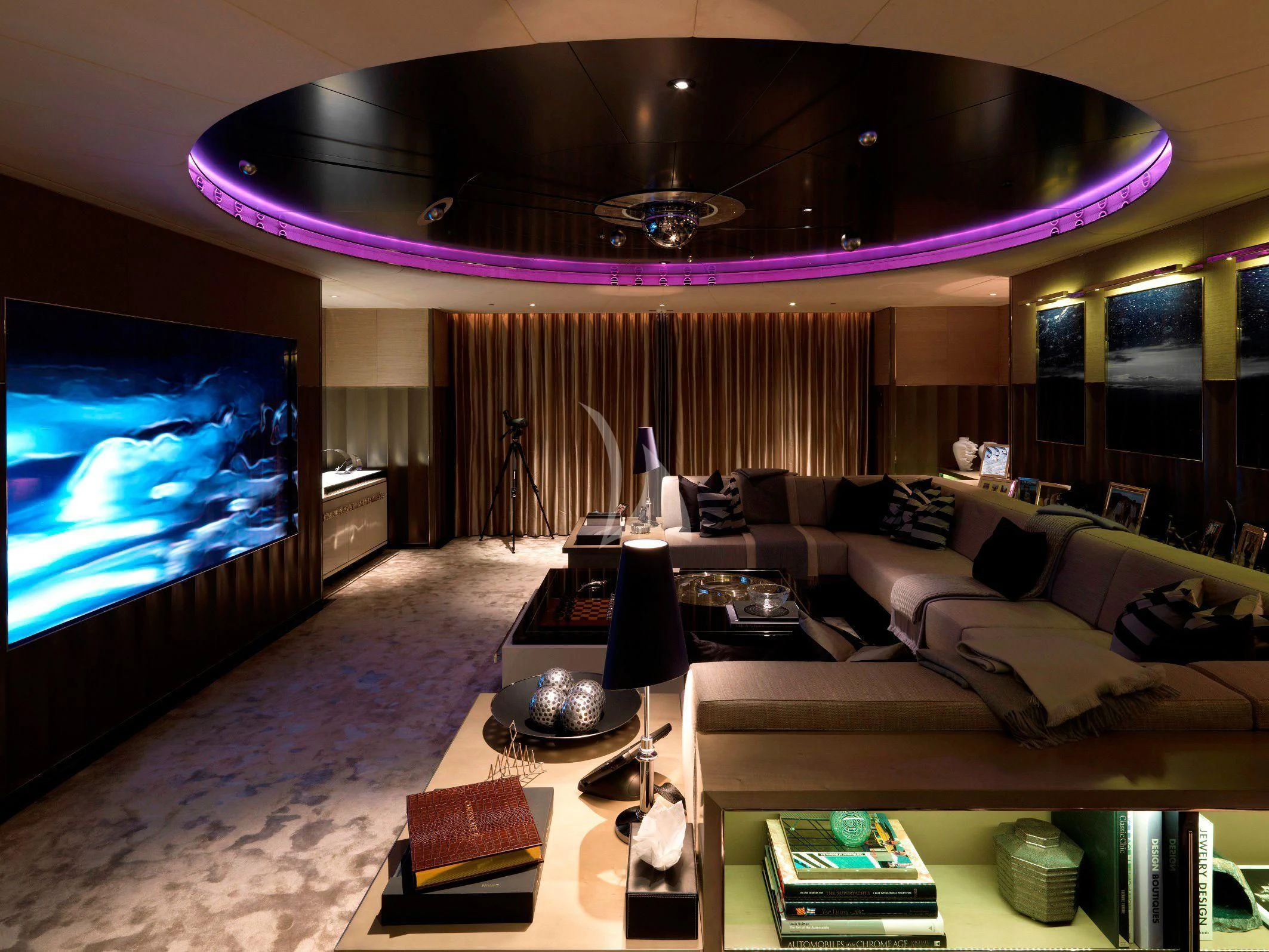 a living room with a large screen aboard SEALION Yacht for Sale