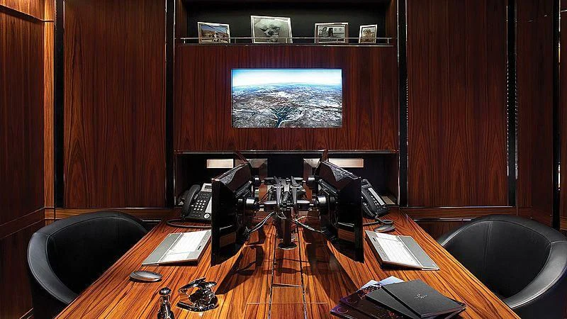 a room with a television and a table with a computer aboard SEALION Yacht for Sale