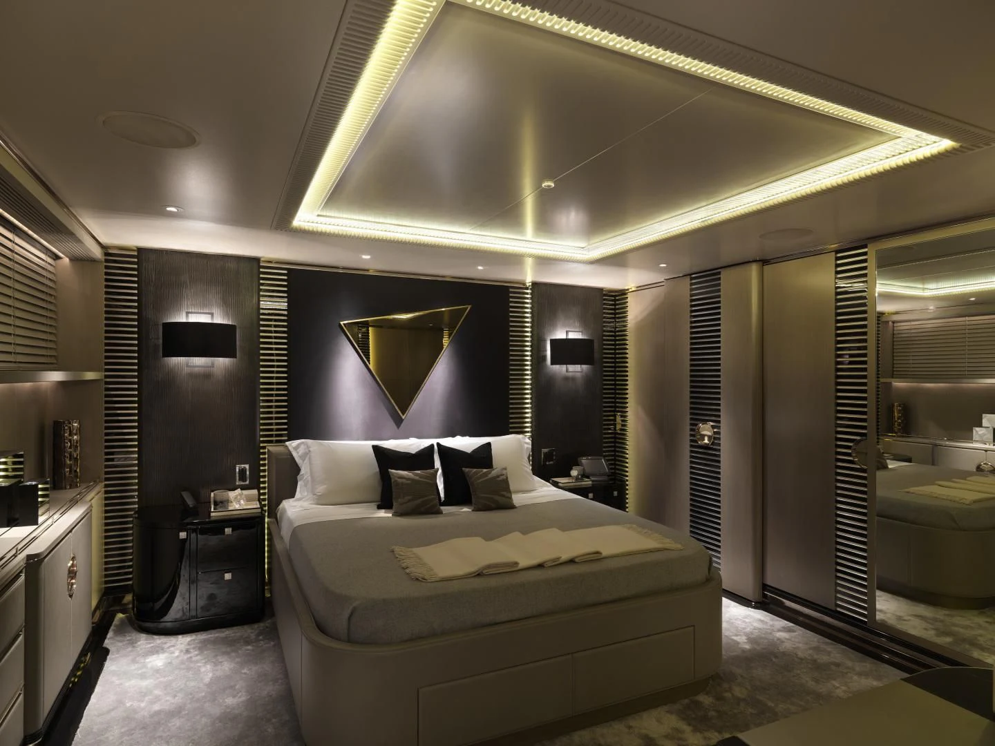 a large bedroom with a large bed aboard SEALION Yacht for Sale