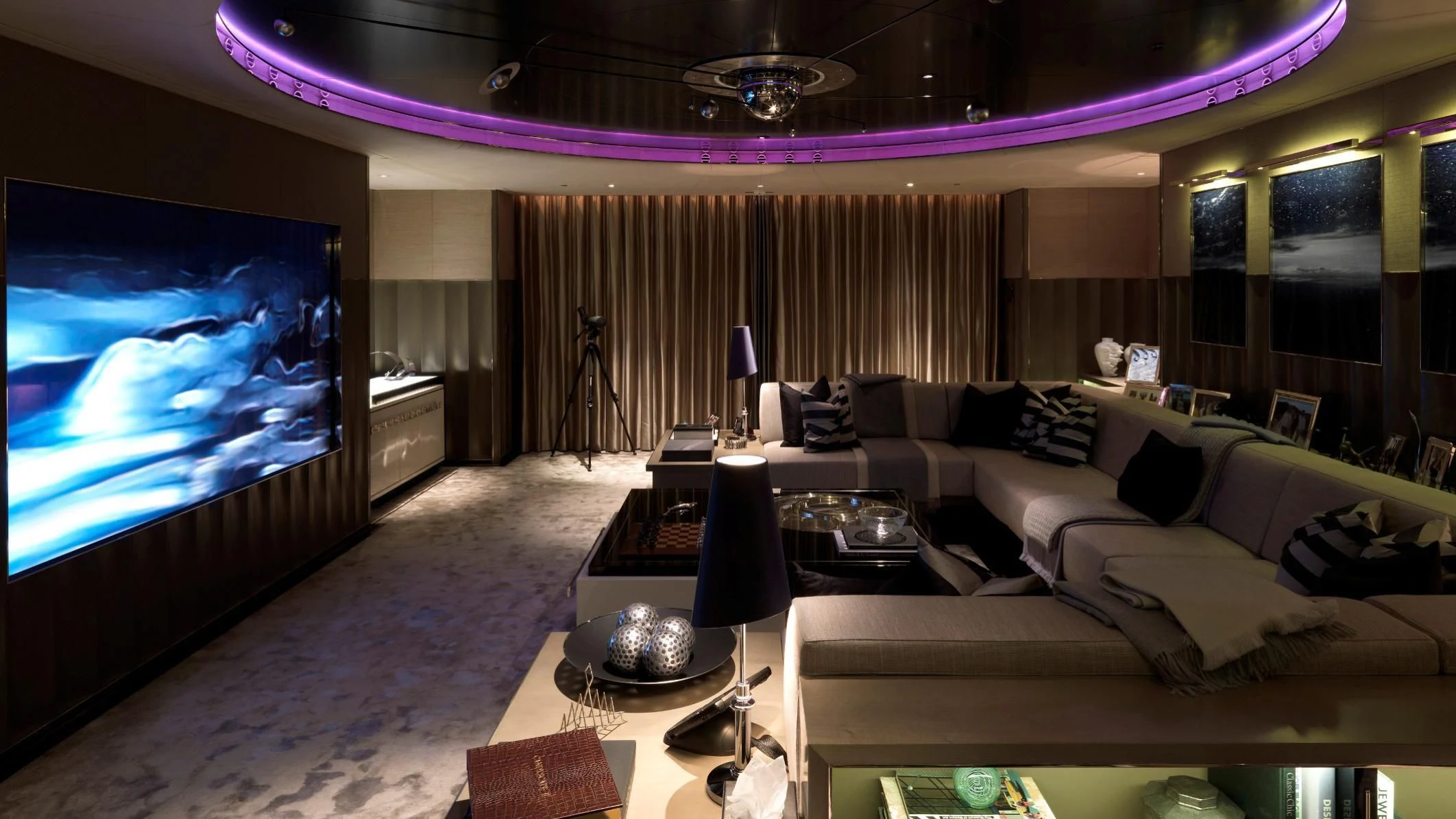 a room with a large screen aboard SEALION Yacht for Sale