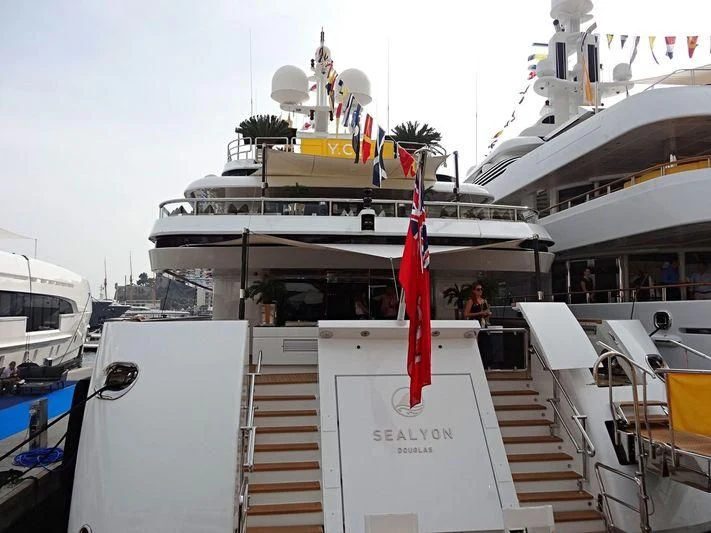a boat with a flag on the deck aboard SEALION Yacht for Sale