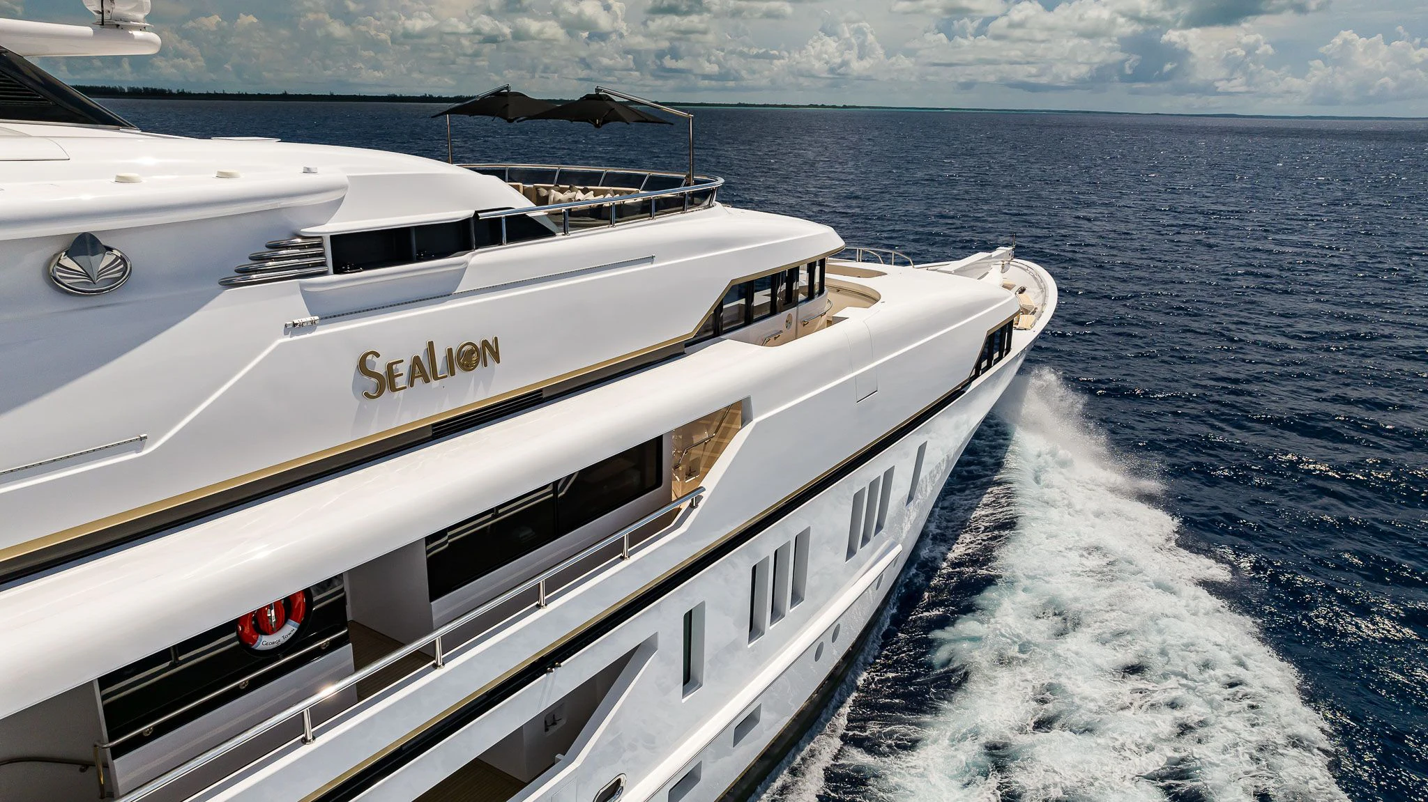 a white yacht on the water aboard SEALION Yacht for Sale