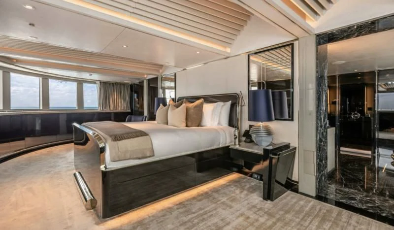 a large bedroom with a large bed aboard SEALION Yacht for Sale