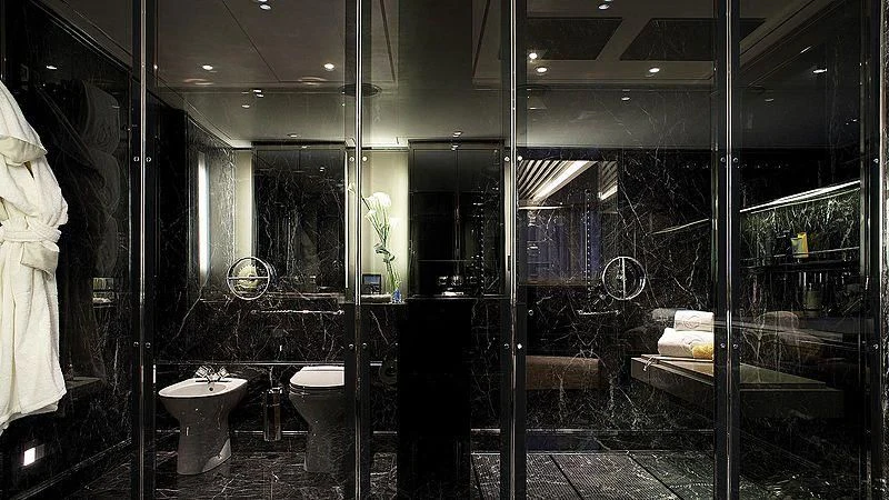 a bathroom with a glass wall aboard SEALION Yacht for Sale