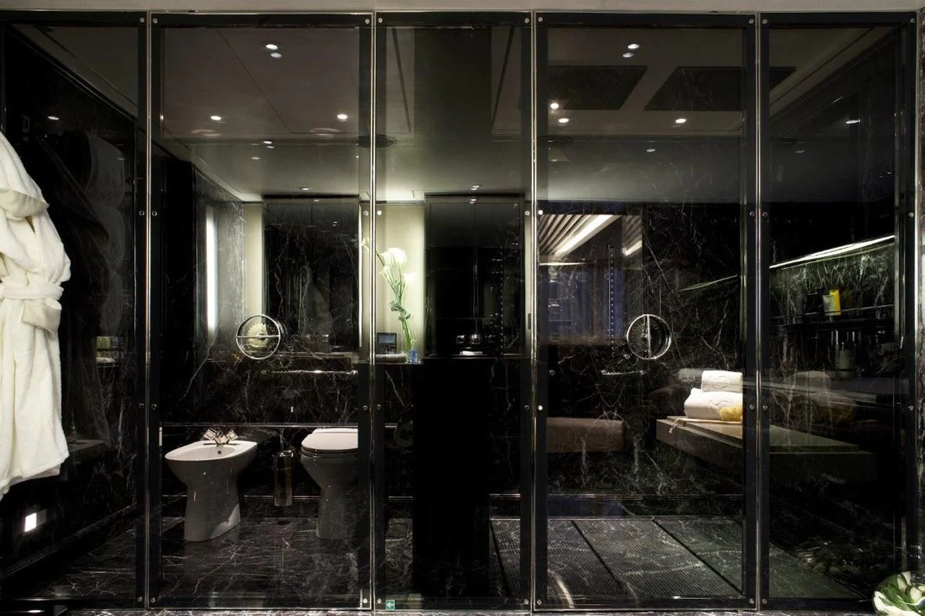 a bathroom with a glass wall aboard SEALION Yacht for Sale