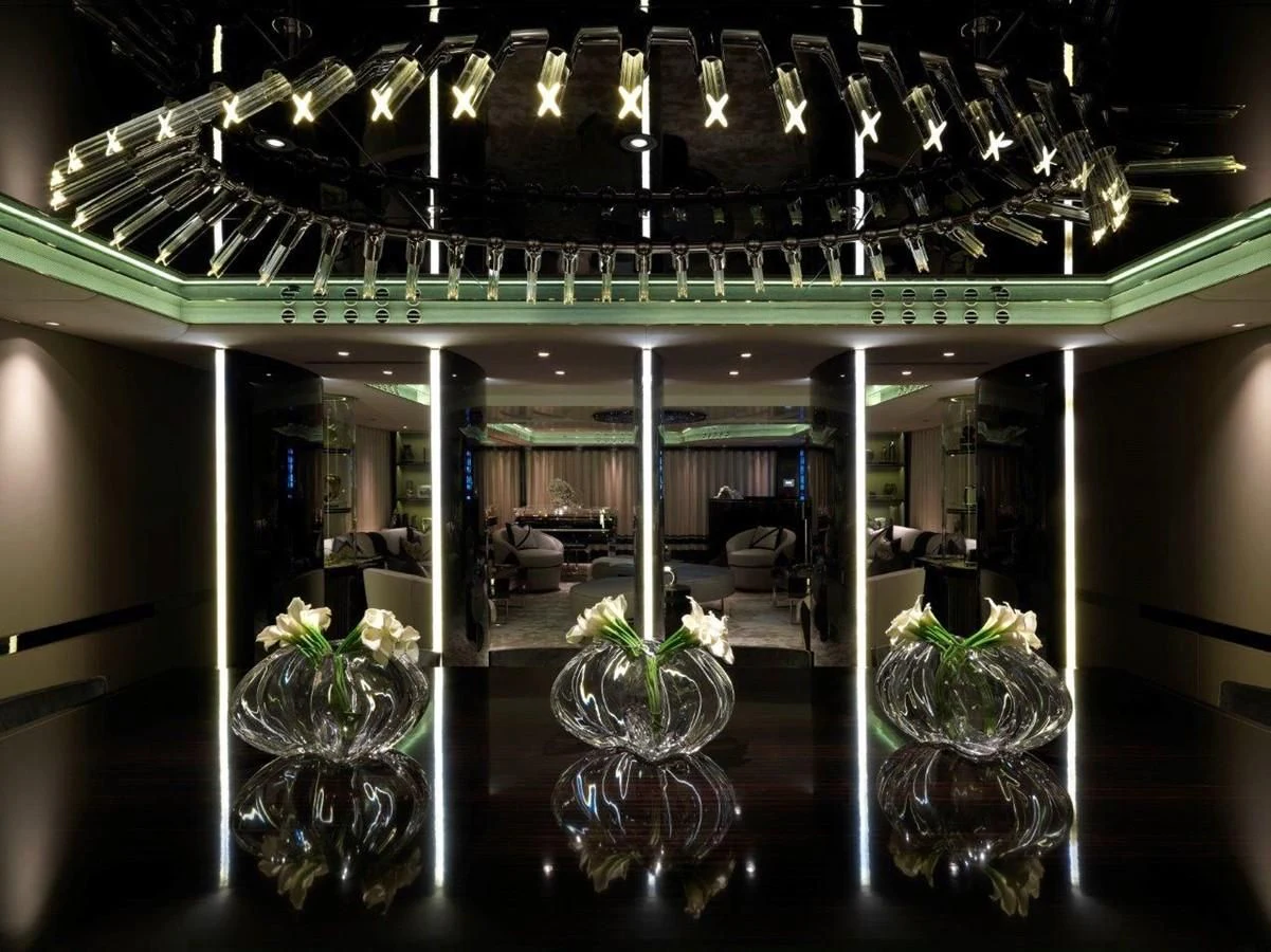 a group of glass vases with flowers in them aboard SEALION Yacht for Sale