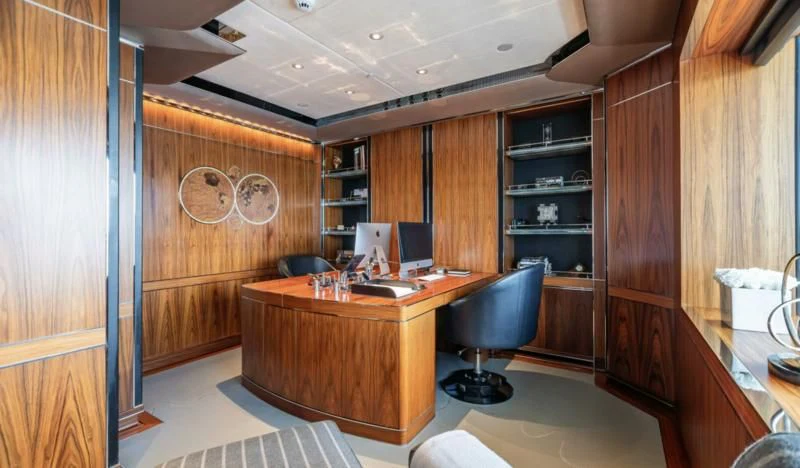 a room with a desk and computer aboard SEALION Yacht for Sale