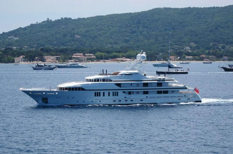 a large white boat on the water aboard SEALION Yacht for Sale