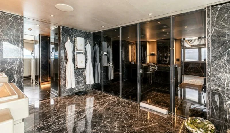 a large bathroom with a large glass shower aboard SEALION Yacht for Sale