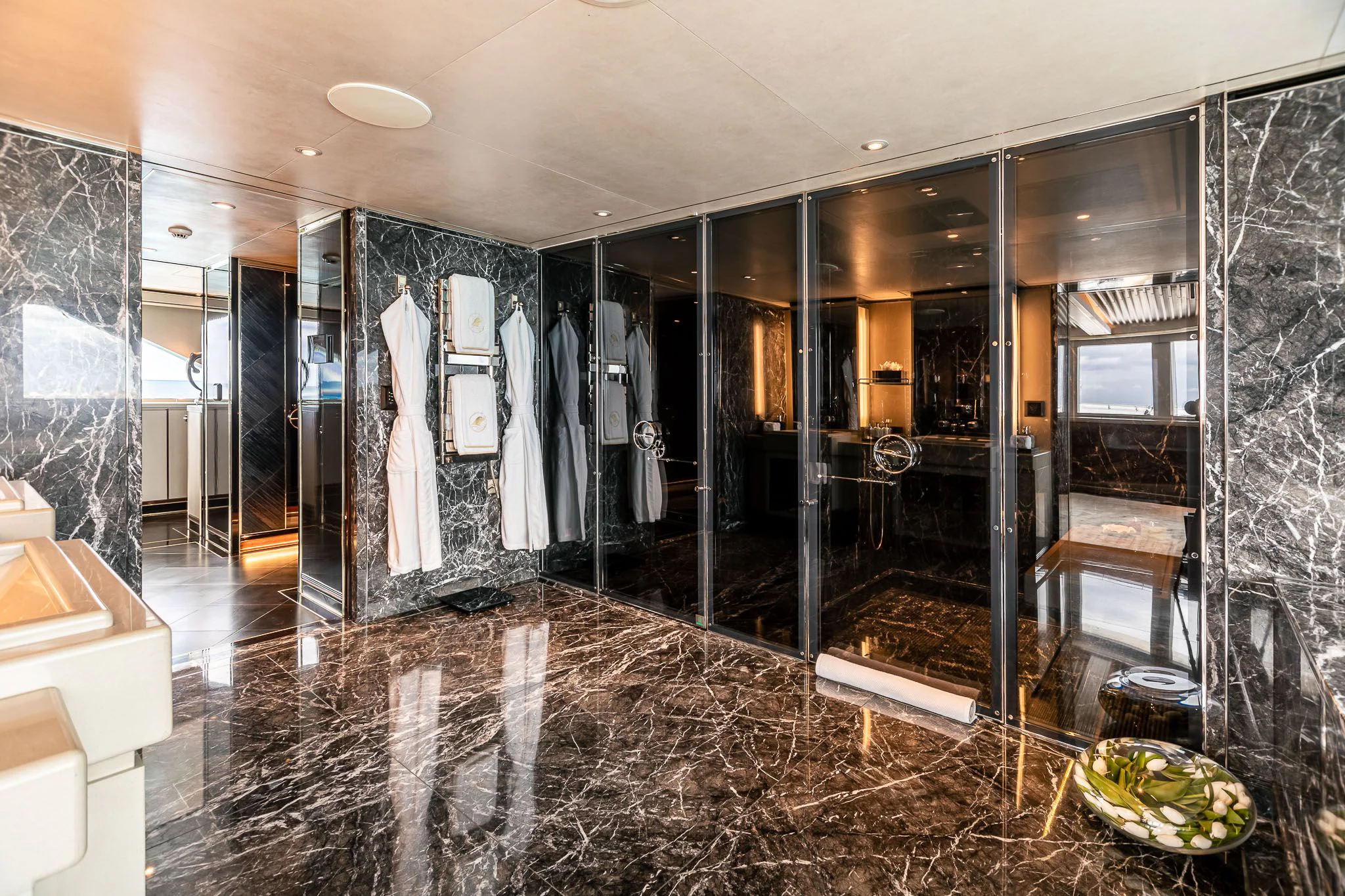 a large bathroom with a glass shower aboard SEALION Yacht for Sale