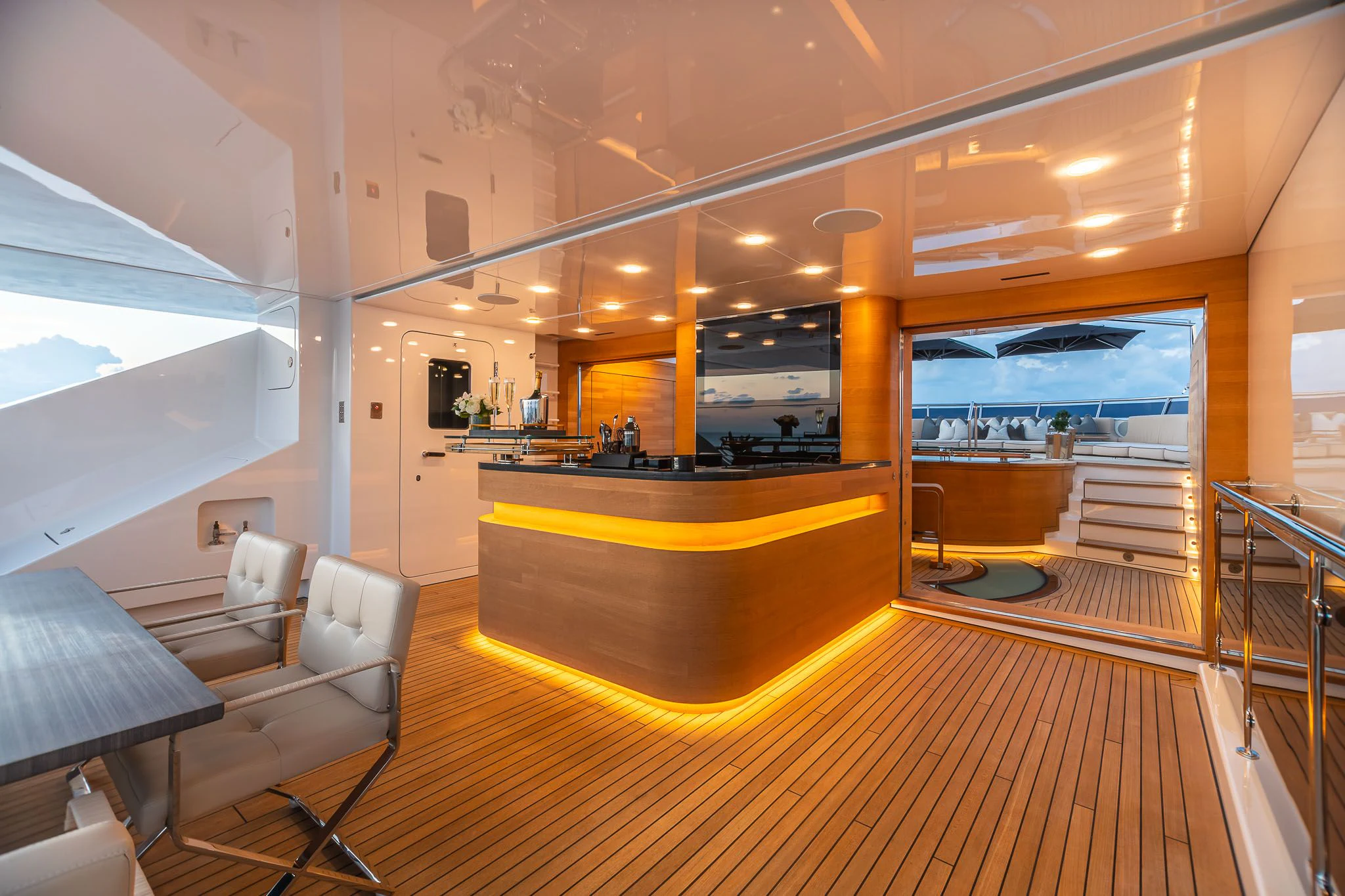 a room with a table and chairs aboard SEALION Yacht for Sale
