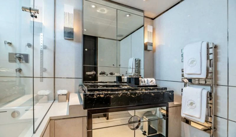a bathroom with a large mirror aboard SEALION Yacht for Sale