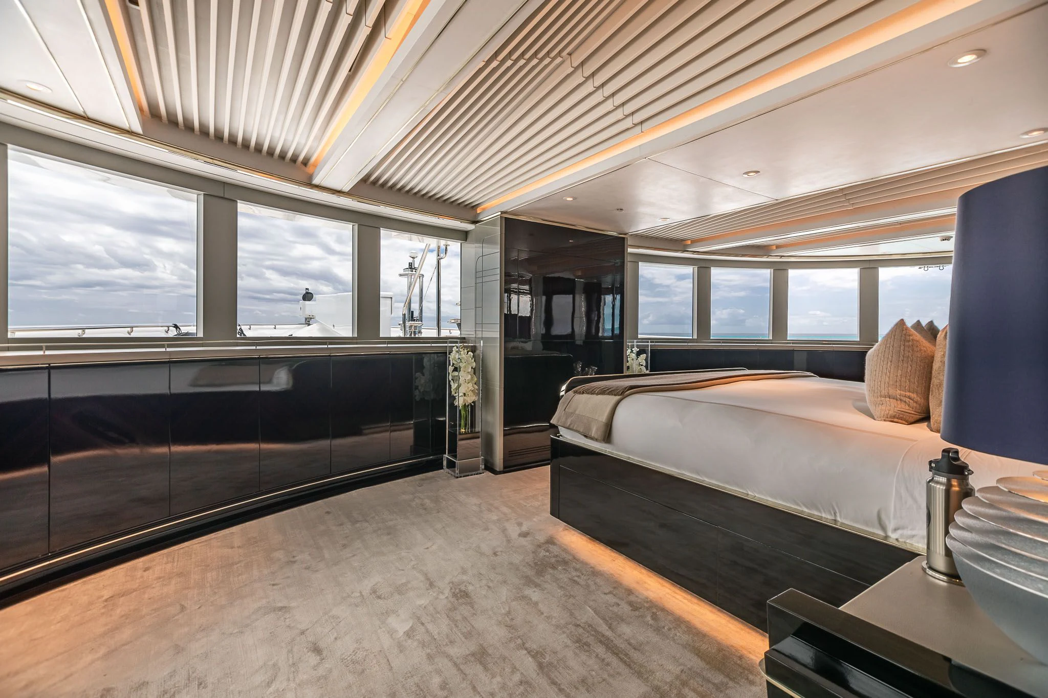 a room with a bed and a desk aboard SEALION Yacht for Sale