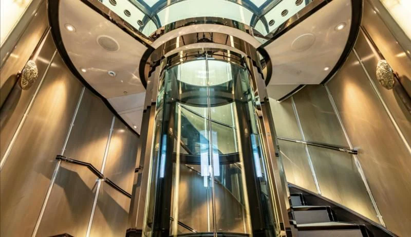 a hallway with glass doors aboard SEALION Yacht for Sale
